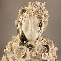 Deborah Ellsmore - pottery classes-a pottery bust of a woman adorned with flowers